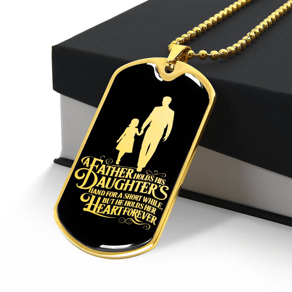 A father holds his daughter's hand